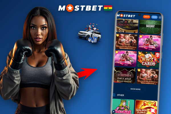 Young Ghanaian player enjoying Mostbet online betting on his smartphone